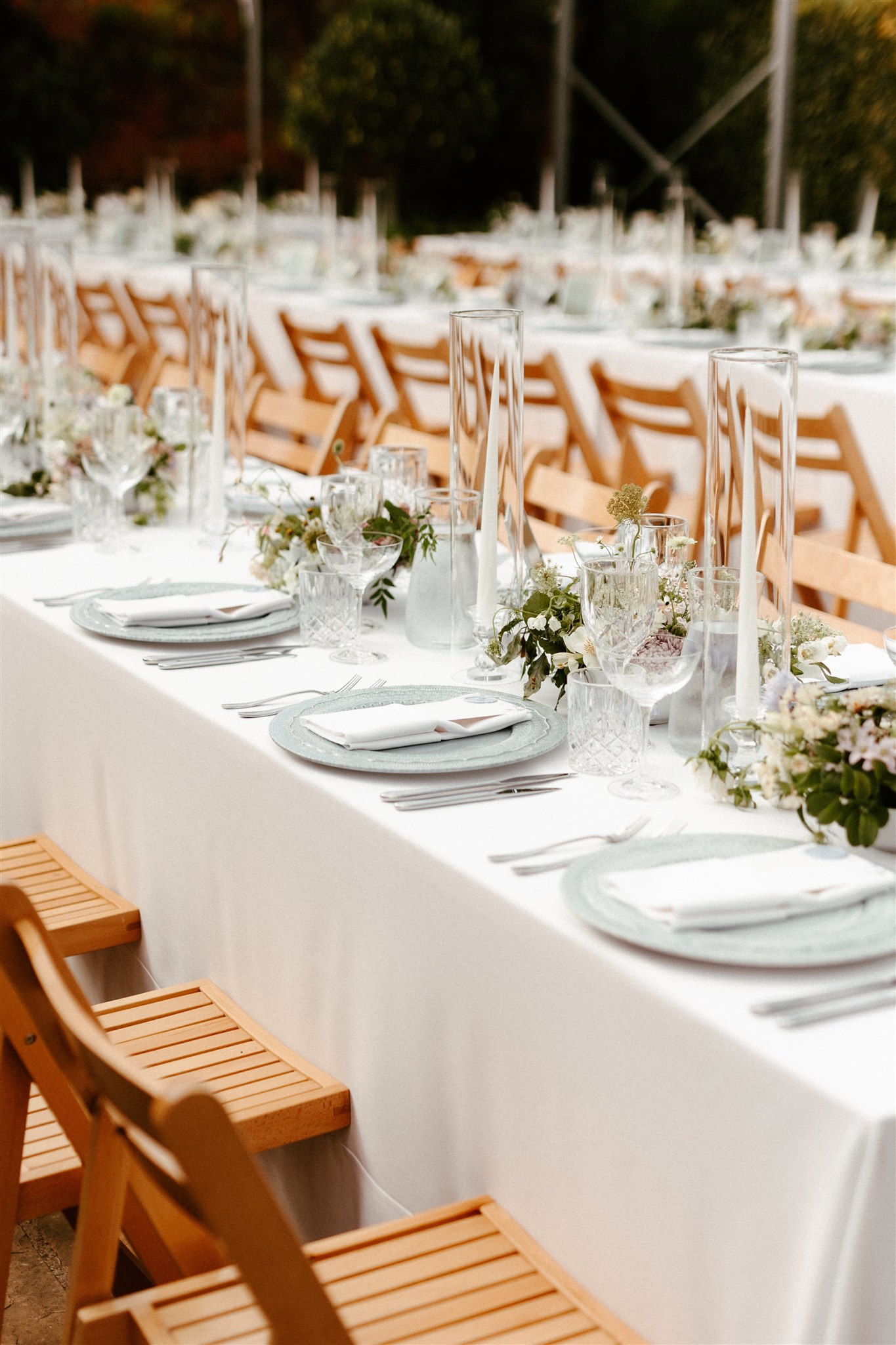 White table linen and folded napkins on an elegantly set dining table